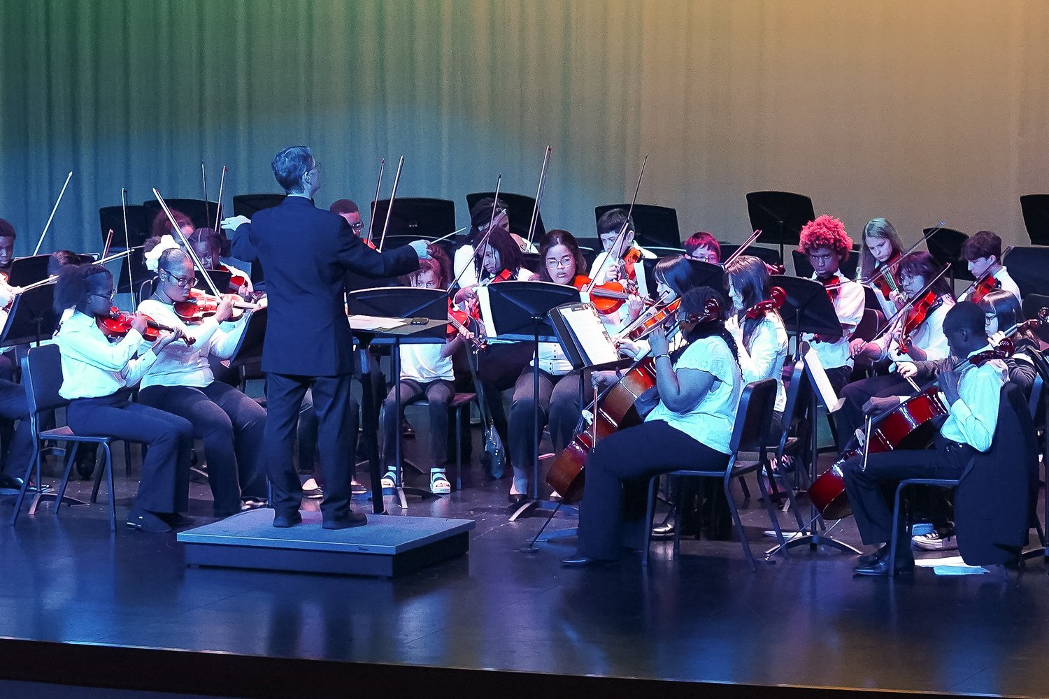 Youth Orchestra Academy students with Associate Conductor Laszlo Stan